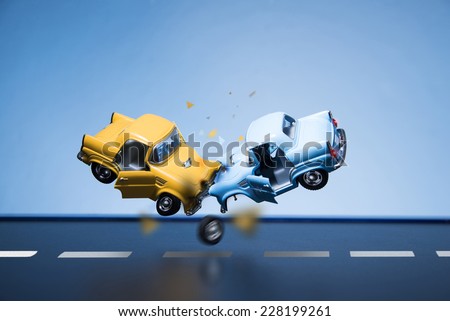 Classic fifties scale model toy cars accident on the road. Royalty-Free Stock Photo #228199261