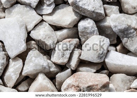 Macro photo of crumbs of decorative stone construction stone design background. Marble chips.