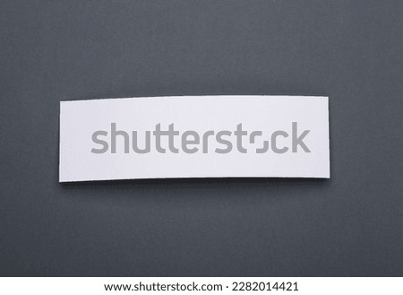 Mockup of two white blank tickets or flyers on dark gray background. Template for design