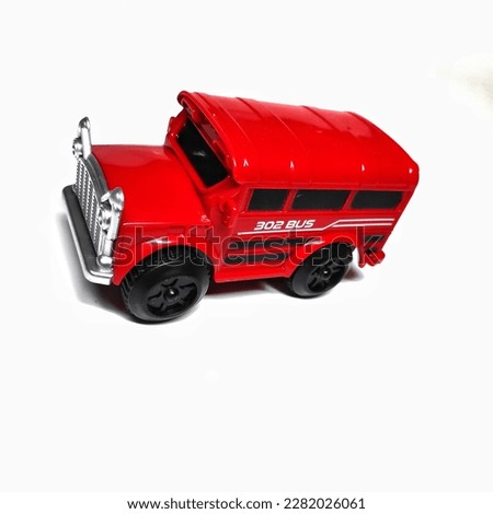 Red toy car in portrait with white background