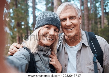 Old couple, selfie and hiking in forest, happy people in portrait, nature and memory for social media post. Smile in picture, adventure and fitness, man and woman with active retirement and outdoor
