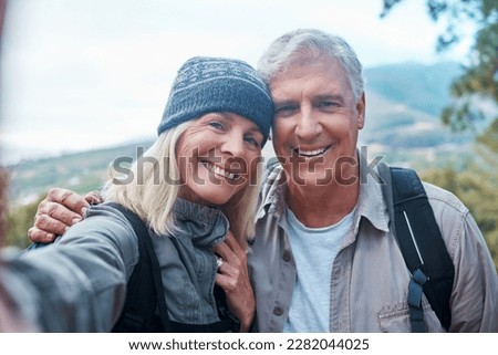 Old couple, selfie and portrait, hiking in forest and happy people in nature and memory for social media post. Smile in picture, adventure and fitness, man and woman with active lifestyle and outdoor