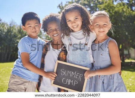 Summer camp, portrait or kids hugging in park together for fun, bonding or playing in outdoors. Boys, girls or happy young best friends smiling or embracing on school holidays outside with board sign