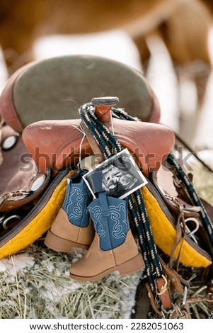 Ultrasound baby photo in cowboy boots to announce pregnancy 