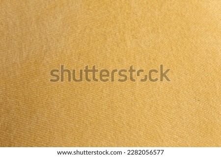 fabric knitwear on wooden background peach color Royalty-Free Stock Photo #2282056577