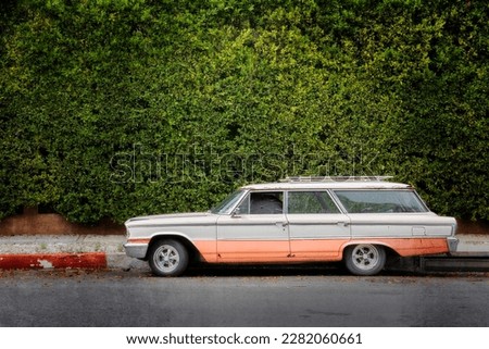 A mid sixties station wagon sits on the street in Hollywood, California. Royalty-Free Stock Photo #2282060661