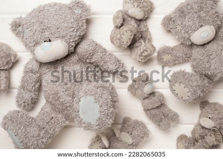 Cute teddy bears on color background, top view