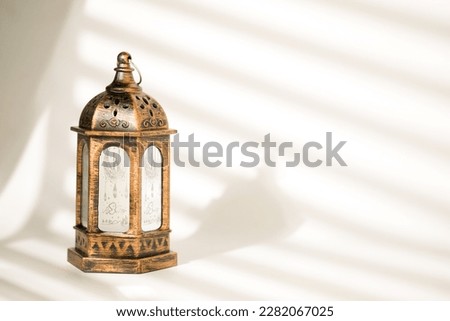 Islamic Lantern for Ramadan Decoration in White Background and Gobo Light Royalty-Free Stock Photo #2282067025