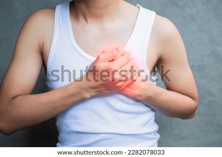 People with chest pain isolated, young man with tachycardia, Guy with heart pain isolated background, young man with heart pain. Concept of people with heart problems Royalty-Free Stock Photo #2282078033