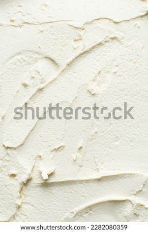 Top view of american buttercream spread out, buttercream with air pockets, textured buttercream Royalty-Free Stock Photo #2282080359