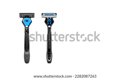 reusable razor with replaceable blades, for men, close-up on a white background, top view, empty space to insert text Royalty-Free Stock Photo #2282087263