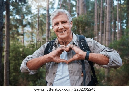 Portrait, heart and senior man in forest hiking, fitness and health support, self care hands and cardiovascular workout. Nature, travel or trekking of happy person in woods with love sign or emoji Royalty-Free Stock Photo #2282092245