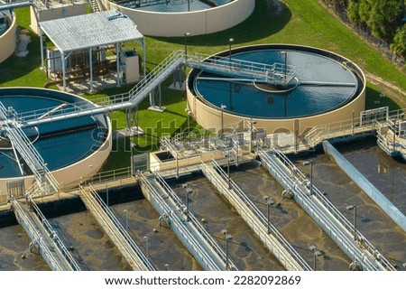 Aerial view of water treatment factory at city wastewater cleaning facility. Purification process of removing undesirable chemicals, suspended solids and gases from contaminated liquid Royalty-Free Stock Photo #2282092869