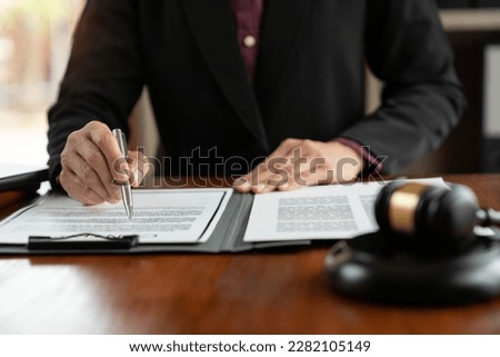 Female lawyer, legal consultant, asian businesswoman checking documents before signing venture capital business finance legal services concept in office.