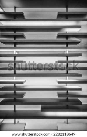 Light, Shadow, and Silhouette on Parallel Boards with a White Background.