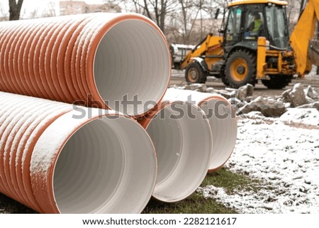 Repair of roads and communications. Replacement of sewer pipes and drains. pipes. Site on a city street. communications repair.