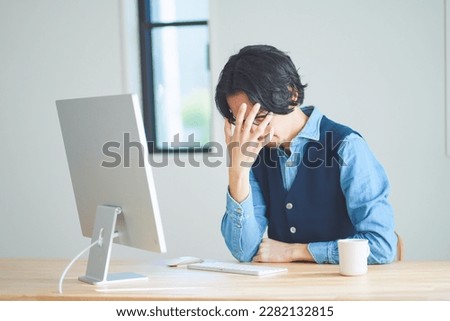 Men with tired eyes from computer work Royalty-Free Stock Photo #2282132815