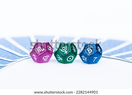 Astrological dices fortune telling divination tools, Eight house in astrology with Scorpio zodiac sign and Pluto planet symbol, Dice divination with tarot card on background