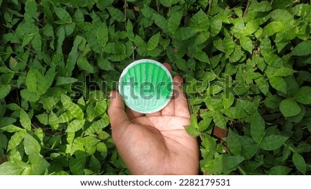 sewing needle on a background of green grass