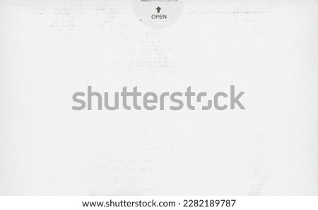 white corrugated cardboard packet with open label