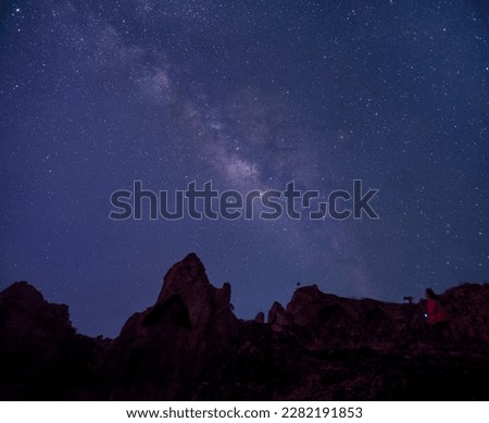 Clear milky way above silhouette of mountain scape