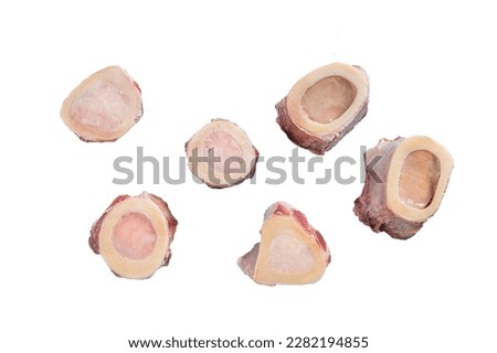 Raw calf Marrow bones on butcher table. Isolated on white background Royalty-Free Stock Photo #2282194855