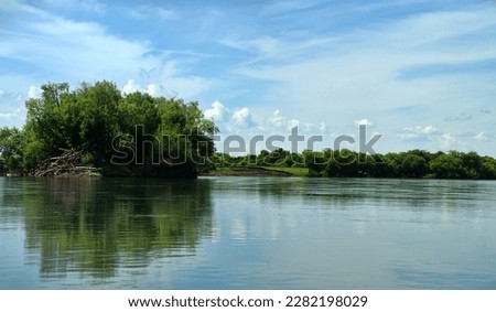 Geography, potamology. Middle Siberia (south part). Panorama of powerful rivers, taiga forest. Piling up of tree trunks after high water (on island). - absence of people and virginal natural area Royalty-Free Stock Photo #2282198029