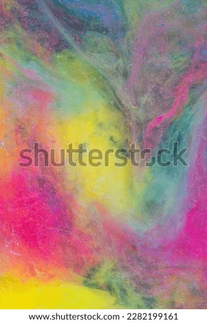 Photo of beautiful mixtures of colorful substances in the deep space. Abstract texture of colorful splashes. Expressive swirls.
