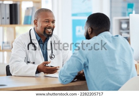 Happy, talking and doctor with a black man for healthcare, support and advice on treatment. Smile, consulting and an African gp with a patient speaking about medicine, health and professional help Royalty-Free Stock Photo #2282205717