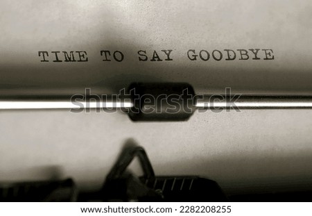 Text Time to Say Goodbye typed on retro typewriter