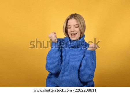 Photo of ecstatic lady shout loud yeah fist up raise win lottery 