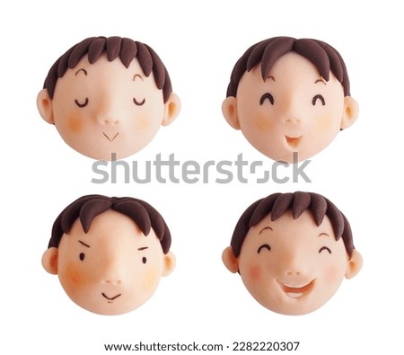 Boy's smiling faces(This is a photo of a clay work)