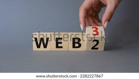 Web 3 vs Web 2 symbol. Businessman Hand turns cubes and changes the word web 2 to web 3. Beautiful grey background. Business concept. Copy space