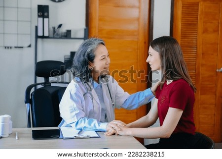  Female doctor filling up an application form while consulting patient. Medicine and health care concept. Medicine and health care concept



