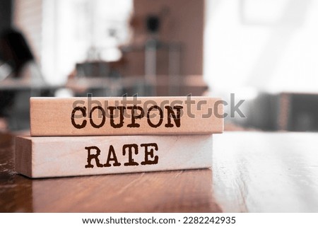 Wooden blocks with words 'COUPON RATE'.