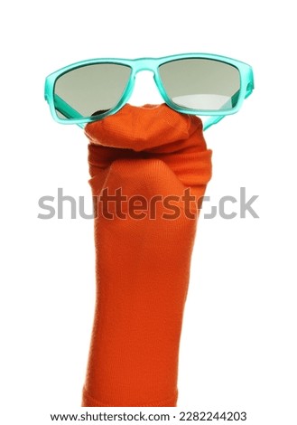 Funny sock puppet with sunglasses isolated on white Royalty-Free Stock Photo #2282244203