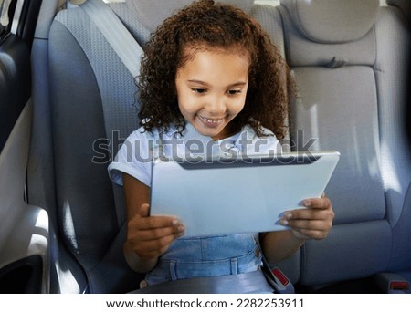 Happy, car and girl with tablet, safety and streaming cartoons with happiness, relax and apps. Young person, female child and kid with device, vehicle and travelling with smile, connection and calm