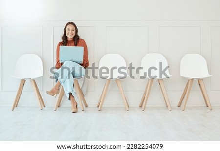 Portrait, laptop and woman in waiting room, interview or recruitment, hiring or office job. Computer, hr and happiness of business person or Asian female from Japan sitting on chair for employment. Royalty-Free Stock Photo #2282254079