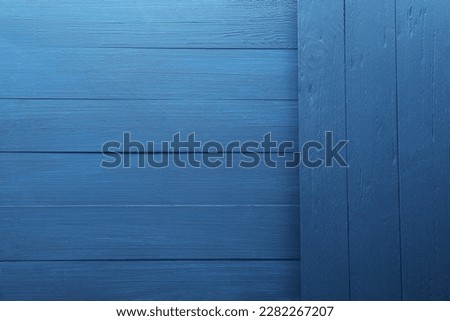 Blue wooden surfaces as background, top view