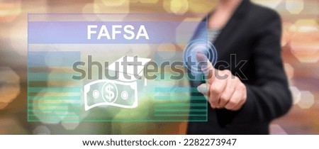 Woman touching a fafsa concept on a touch screen with her finger