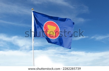 ASEAN flag in the cloudy sky. waving in the sky Royalty-Free Stock Photo #2282285739