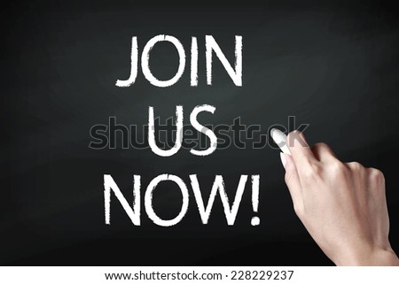  Hand holding a chalk and writing join us now 