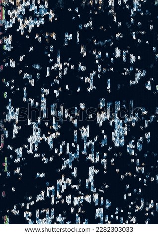 Sequin texture. Abstract background. Shiny circles. Blue orange silver glowing shimmering round flecks dust noise on dark black grunge wallpaper.