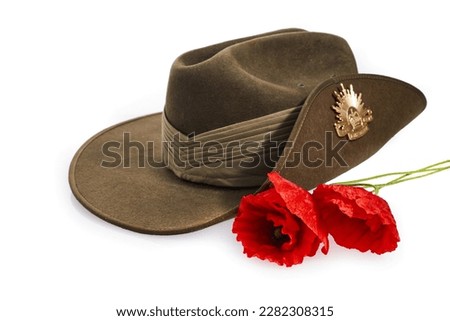 Anzac Day army slouch hat with red poppy isolated on white background. Royalty-Free Stock Photo #2282308315