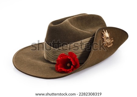 Anzac Day army slouch hat with red poppy isolated on white background. Royalty-Free Stock Photo #2282308319