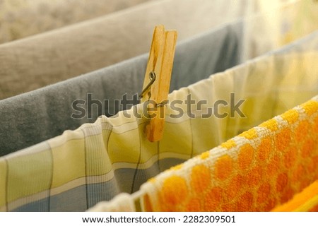 close-up of wet laundry hanging and drying on a wire room dryer, home chores concept, gentle hand washing of lacy underwear, homework, selective focus at shallow depth of field