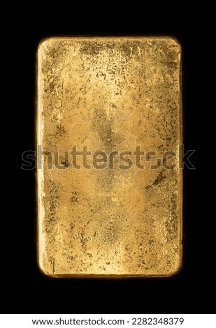 Surface of the back side of a cast gold bar, also known as gold bullion. Refined, pure metallic gold, produced by by pouring molten metal into a bar-shaped mold. Isolated on black background. Photo.