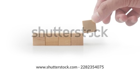 Wooden cubes in hand with copy space for input wording and infographic