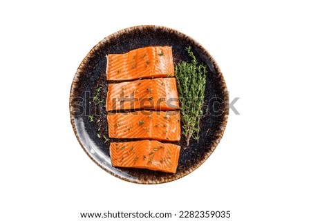 Salmon fillet steaks, raw fish with thyme and herbs. Isolated on white background Royalty-Free Stock Photo #2282359035