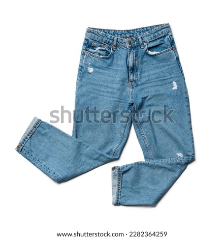 Blue jeans on a white background, view from above Royalty-Free Stock Photo #2282364259